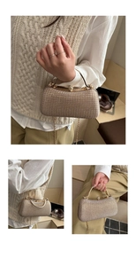 Detail of champagne evening clutch with rhinestones, gold handle and chain strap