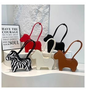Detailed display of horse-shaped shoulder bags in red, black, zebra, white, and brown