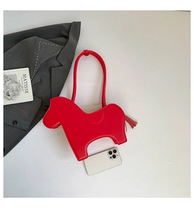 Detail of red horse-shaped PU leather shoulder bag with tassel and size reference