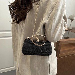 Sparkling black glitter box clutch bag with gold rhinestone handle and chain strap
