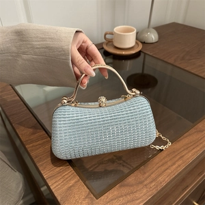 Elegant light blue rhinestone evening bag with gold metal handle and sphere lock