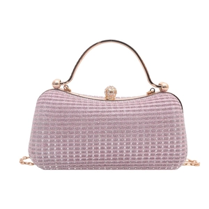 Pink evening box bag with rhinestone clasp, gold handle and glitter woven texture