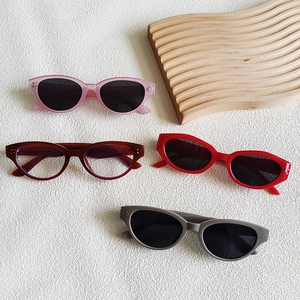 Chic cat-eye sunglasses for men and women in pink, tortoise, red, and matte gray finishes