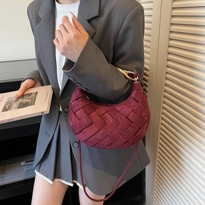 Burgundy woven hobo crescent bag with golden metal handle for women's crossbody wear
