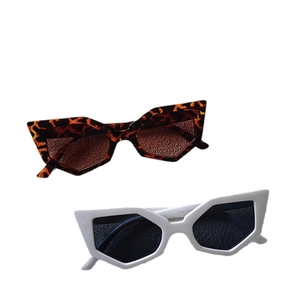 Modern geometric cat-eye sunglasses in leopard print and white frames with tinted lenses