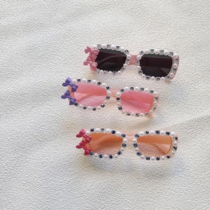Kids rectangle sunglasses with pearls, rhinestones and colorful bows in a three-pair set