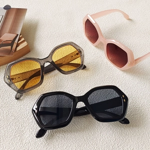 Three pairs of irregular polygonal oversized sunglasses with metallic rivet temple details