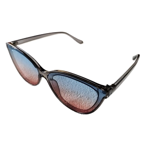 Cat eye sunglasses with blue-pink gradient lenses and translucent dark grey frames