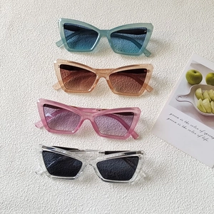 Retro cat-eye sunglasses with thick frames and gradient lenses in four vibrant colors
