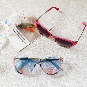 Chic cat-eye sunglasses in rose pink and blue gradient frames with UV protection