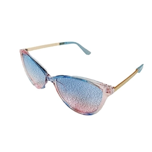Cat eye sunglasses with blue pink gradient lenses and transparent frames with gold metal arms
