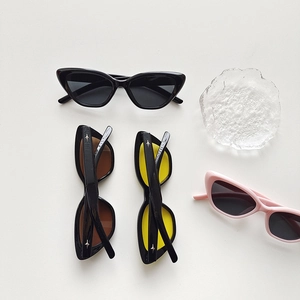 Close-up of cat-eye kids sunglasses with star metal accents in four stylish colors