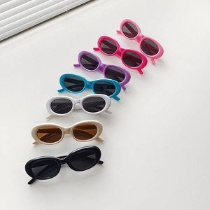 Vibrant Y2K style kids oval sunglasses in multiple candy colors on white background