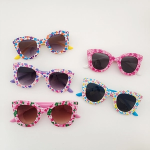 Five pack of floral cat-eye children's sunglasses with colorful flower patterns