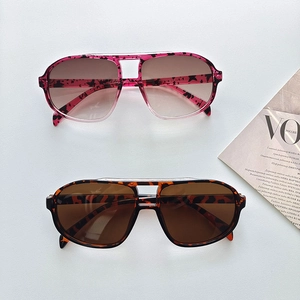 Top view of retro double-bridge sunglasses in pink leopard and brown tortoiseshell finishes