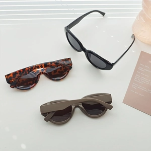 Futuristic sporty sunglasses set in black, leopard, and grey matte finishes