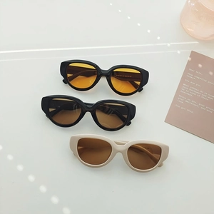 Detailed flat lay of futuristic oval sunglasses with colorful lenses and model KD67186