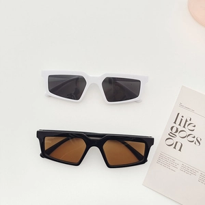 Retro geometric rectangle sunglasses set in glossy black and white frames for street style