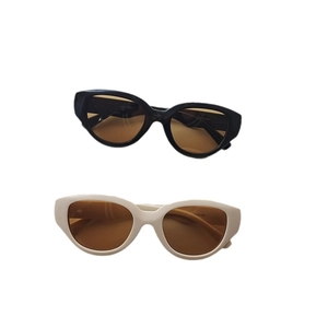 Futuristic retro oval sports sunglasses for men and women with black and cream white frames