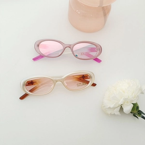 Detail of pink and cream oval kids sunglasses with UV400 labels and CE certification