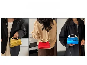 Three metallic acrylic evening bags in gold, red, and blue with stylish metal chain straps