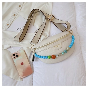Detail of off-white lychee texture leather chest bag with colorful bead chain decoration