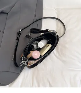 Top-down view of spacious bag interior showing checkered pattern and storage capacity