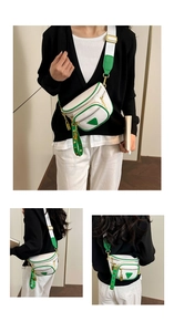 Vue détaillée du sac ceinture en cuir blanc avec bordures vertes et accents en métal