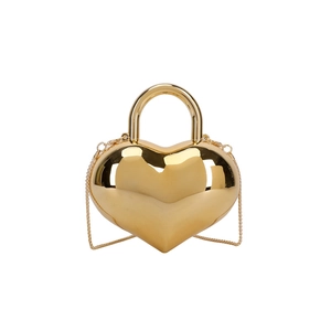 Glossy gold heart-shaped mirror handbag with metal top handle and crossbody chain
