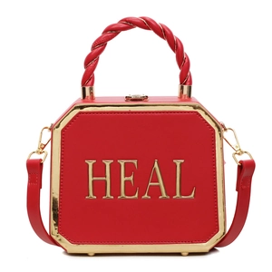 Fashionable red octagonal leather crossbody bag with HEAL gold hardware and top handle