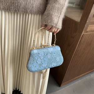 Elegant light blue lace evening bag with gold metal handle and rhinestone closure