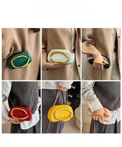 Six colors of fashion clutch bags with gold C-shaped handles shown on models