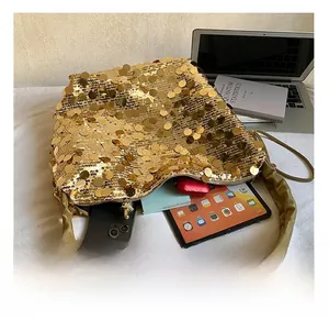 Internal view showing large capacity of sequined bucket bag with daily essentials