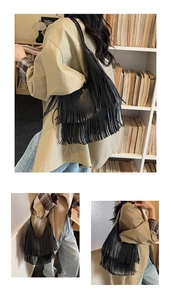 Detailed close-up of layered leather tassels on a black fashion crescent shoulder bag