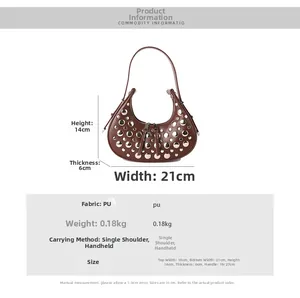 Detailed view of brown rivet crescent bag with dimensions 21x14x6cm and handle height