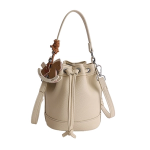 Chic beige lychee leather bucket bag with drawstring closure and rocking horse charm