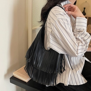 Stylish black hobo shoulder bag with three layers of long tassels and a retro look