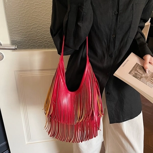 Red bohemian fringe bucket bag with long tassels and comfortable shoulder strap for women