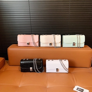Chic snakeskin texture crossbody bags with silver chain straps in five vibrant colors