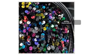 Detailed macro shot of multi-color metallic sequins on a black evening bucket bag