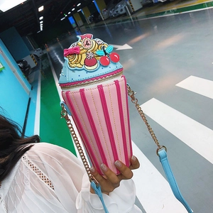 Close-up of creative ice cream sundae bag featuring pink stripes and gold chain strap