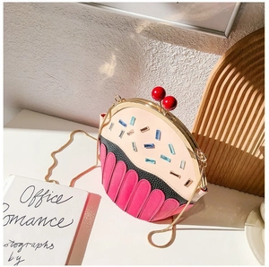 Detailed view of cupcake-shaped crossbody bag featuring colorful rhinestones and gold chain