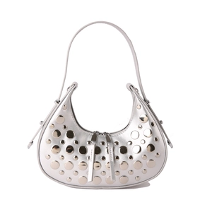 Silver metallic moon hobo bag with punk-style rivets and double zippers on white background