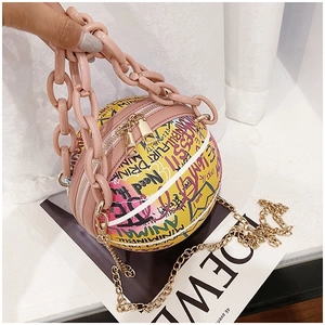 Close-up of graffiti basketball bag with pink chunky chain and dual zip closure