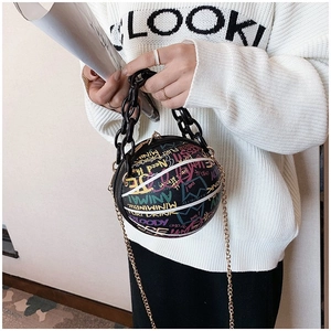 Close-up of creative basketball bag featuring rainbow graffiti and chunky chain handle
