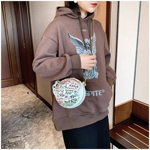 Detail of white basketball shaped bag with colorful graffiti and plastic chain