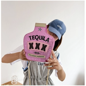 Detail of pink sequin tequila bottle shaped crossbody bag with gold chain strap