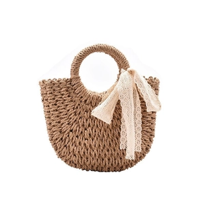 Handmade dark brown straw beach tote with woven handles and elegant white lace ribbon