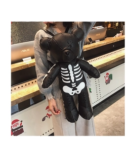 Detail of punk style skull bear backpack in black leather with white rib cage print