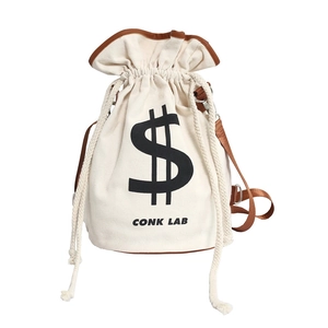 Canvas drawstring bucket bag in off-white with brown leather trim and dollar sign print